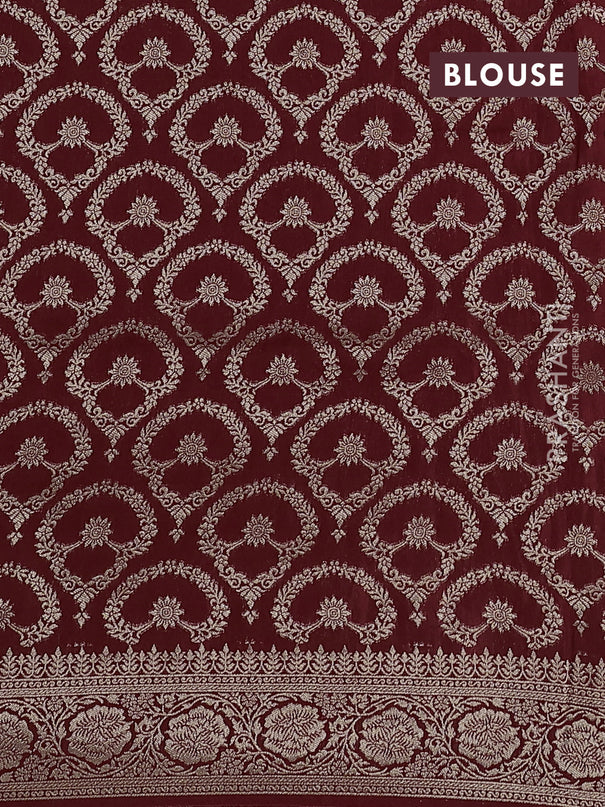 Dola silk saree maroon with plain body and zari woven border