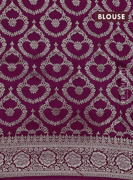 Dola silk saree wine shade with plain body and zari woven border