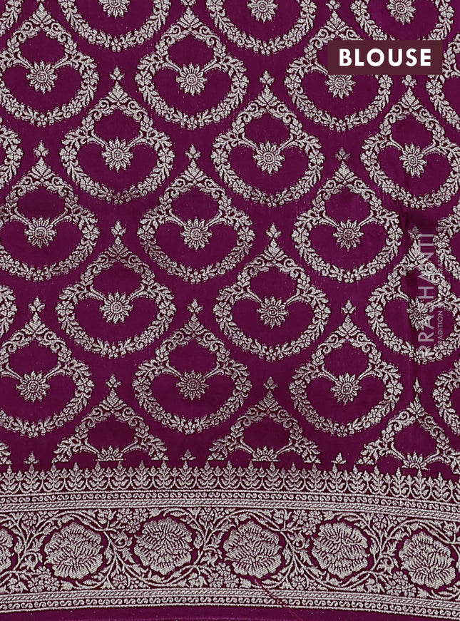 Dola silk saree wine shade with plain body and zari woven border