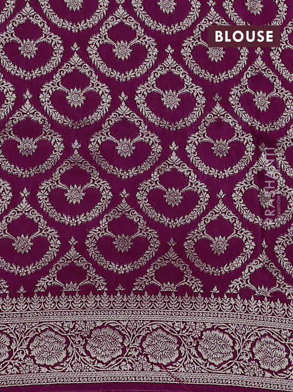 Dola silk saree wine shade with plain body and zari woven border