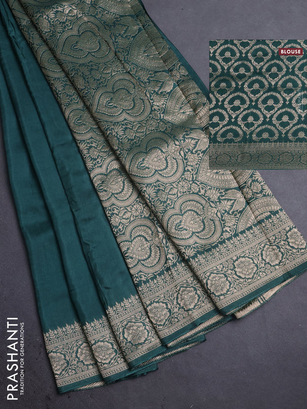 Dola silk saree peacock green shade with plain body and zari woven border