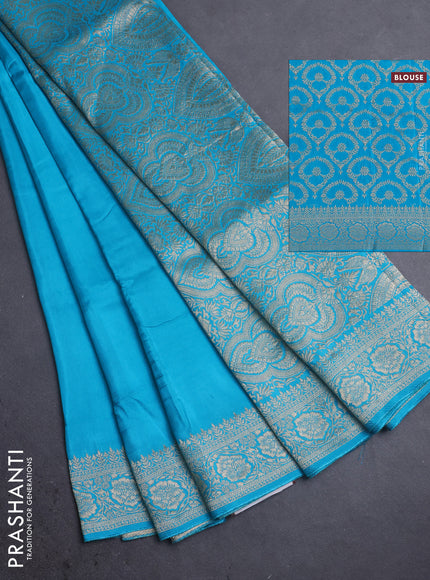 Dola silk saree teal blue with plain body and zari woven border