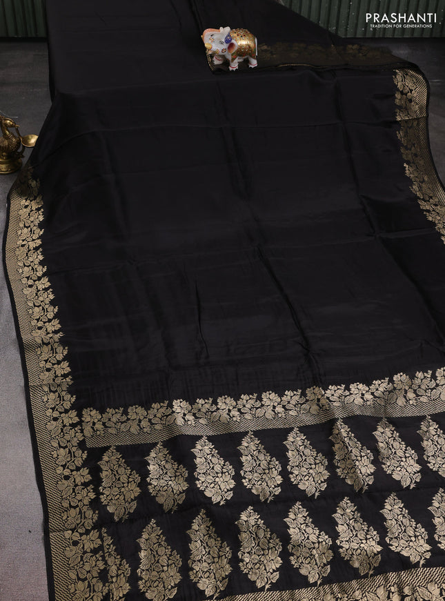 Dola silk saree black with plain body and zari woven border