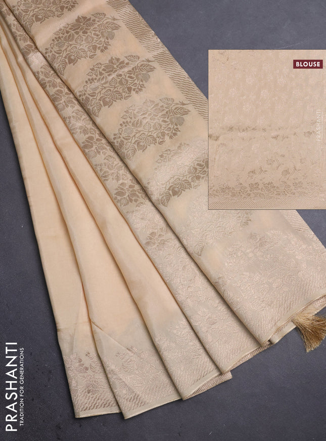 Dola silk saree cream with plain body and zari woven border