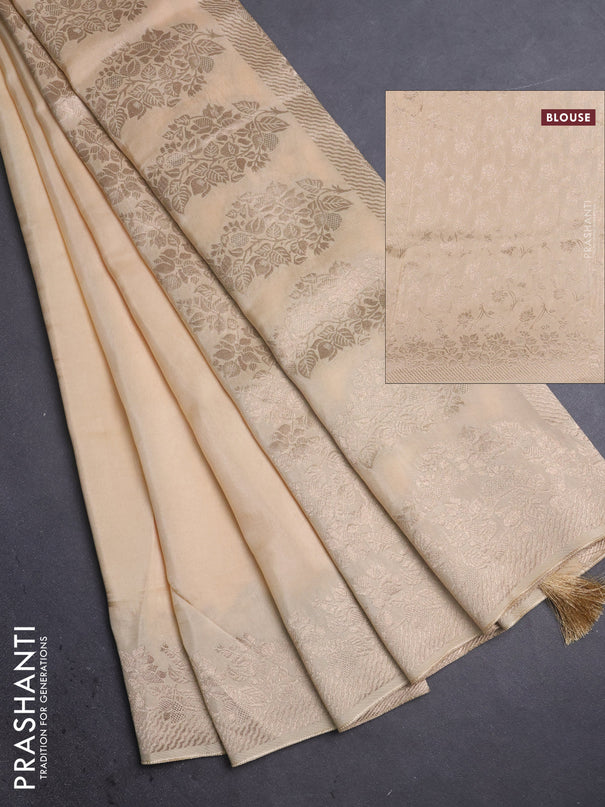 Dola silk saree cream with plain body and zari woven border