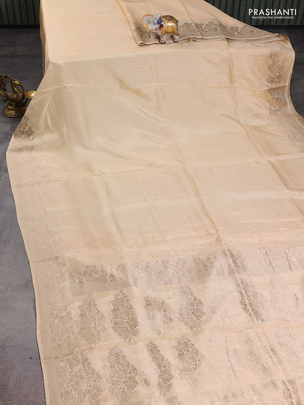 Dola silk saree cream with plain body and zari woven border