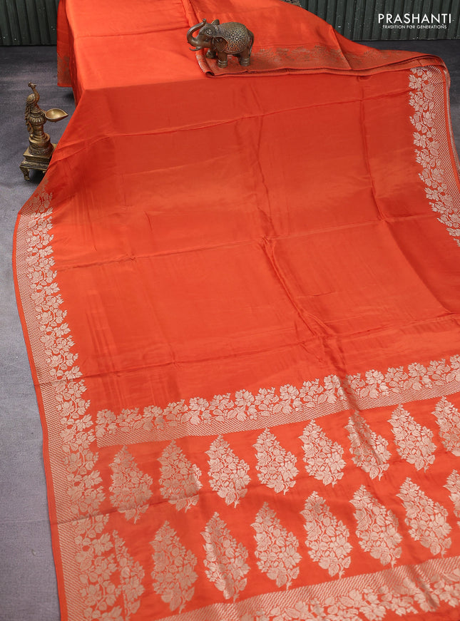 Dola silk saree orange with plain body and zari woven border