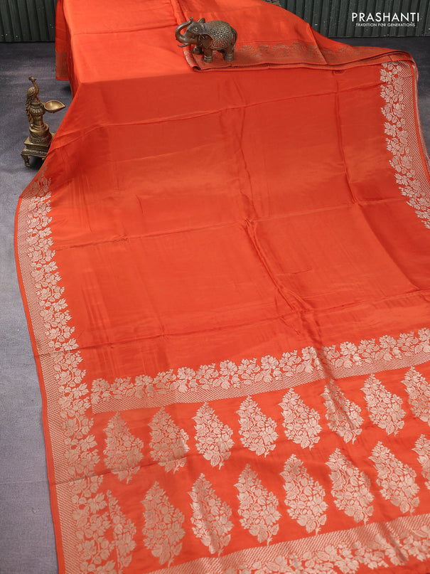 Dola silk saree orange with plain body and zari woven border