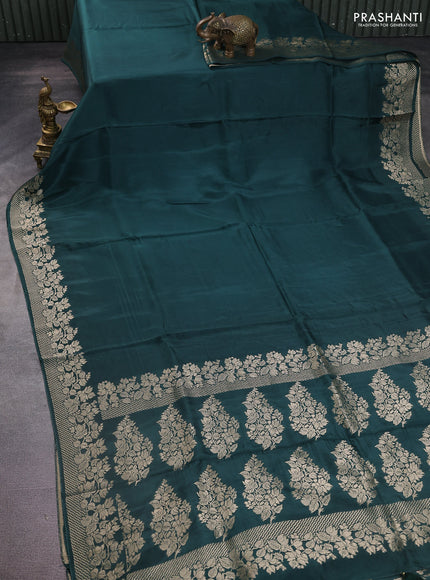 Dola silk saree peacock green shade with plain body and zari woven border