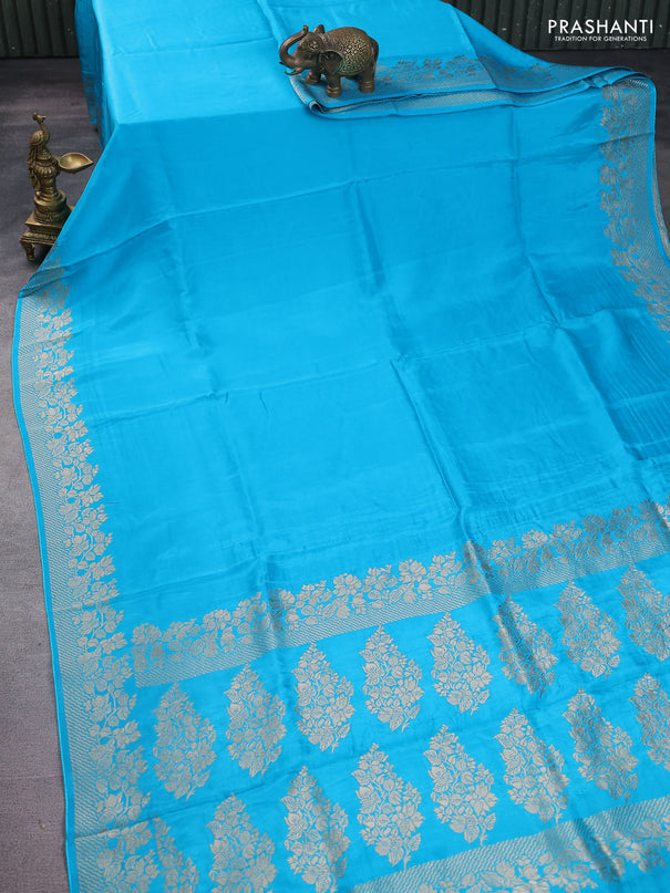 Dola silk saree teal blue with plain body and zari woven border