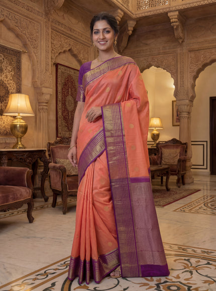 Kora kanchipuram silk saree peach shade and purple with zari woven buttas and rich zari woven border