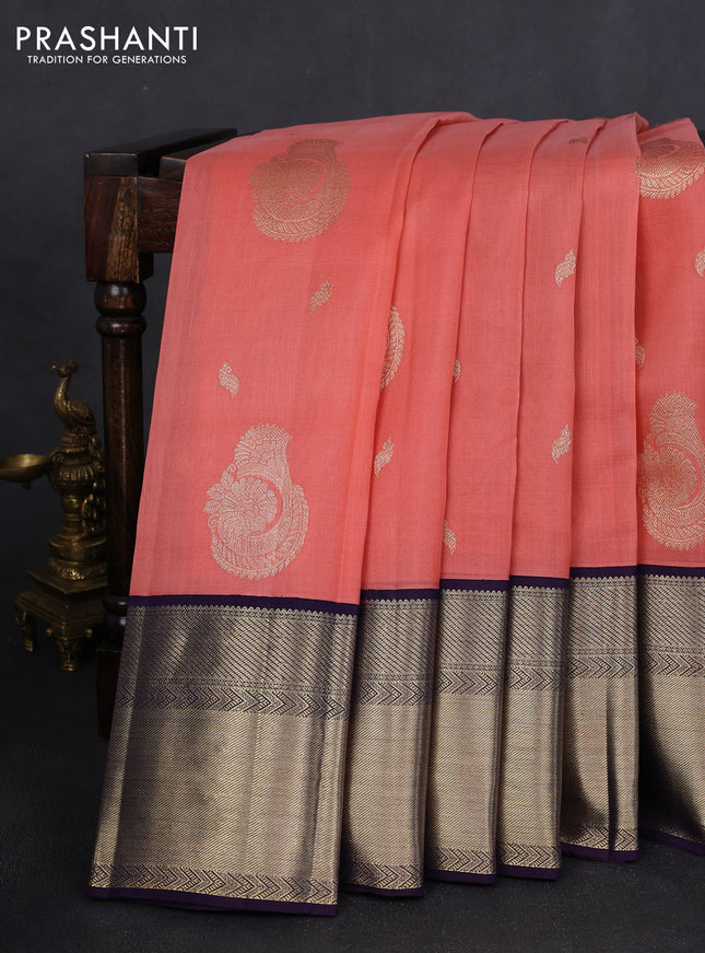 Kora kanchipuram silk saree dark peach and navy blue with zari woven buttas and long rich zari woven border