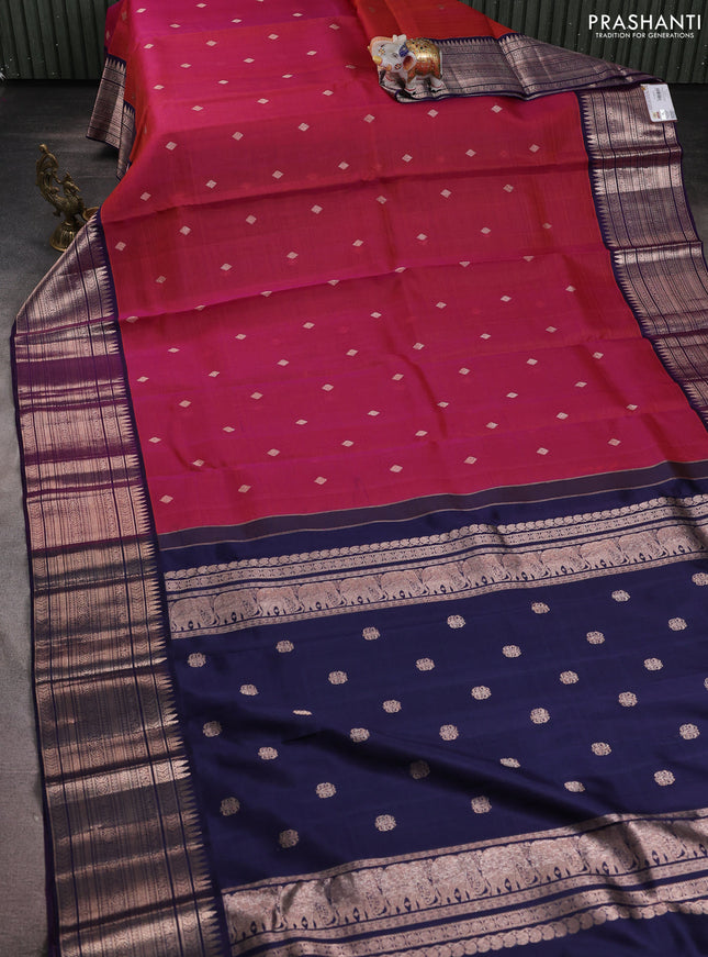 Kora kanchipuram silk saree dual shade of magenta pink and navy blue with zari woven buttas and rich zari woven border