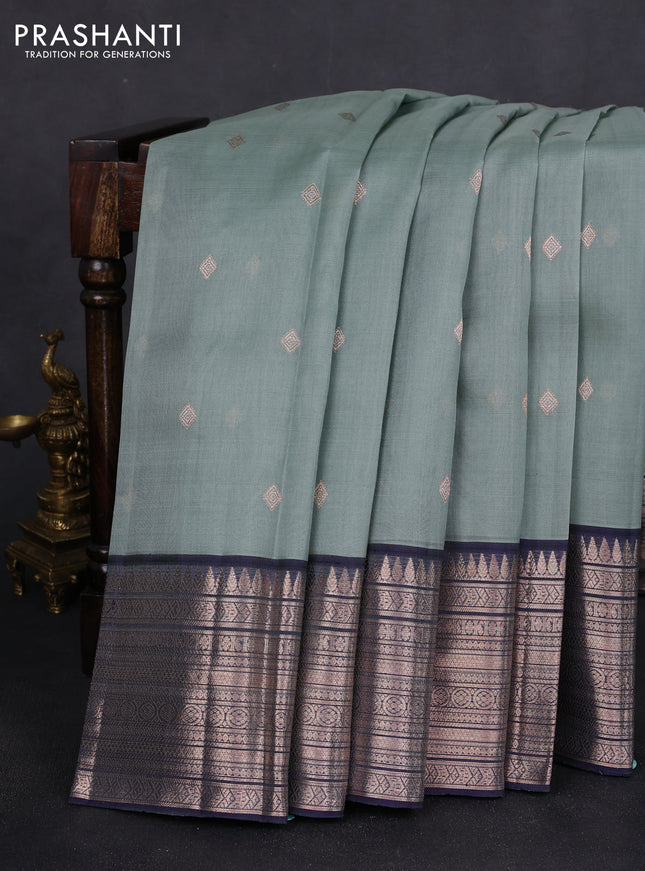 Kora kanchipuram silk saree pastel blue and navy blue with zari woven buttas and rich zari woven border