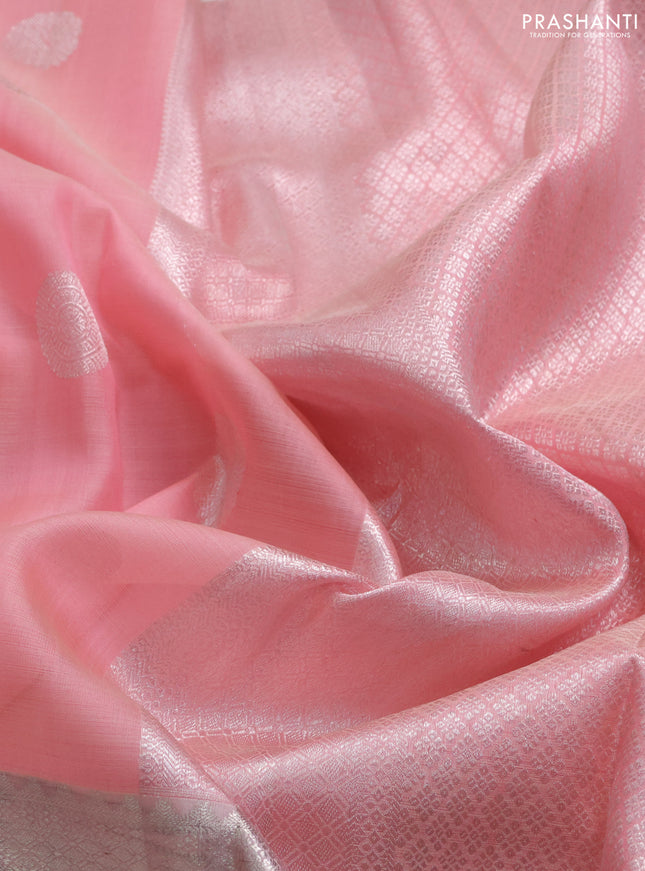 Kora kanchipuram silk saree peach pink and pastel peach with zari woven buttas and long silver zari woven border