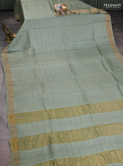 Pure tussar silk saree pastel green and purple shade with allover zari woven checked pattern and zari woven border