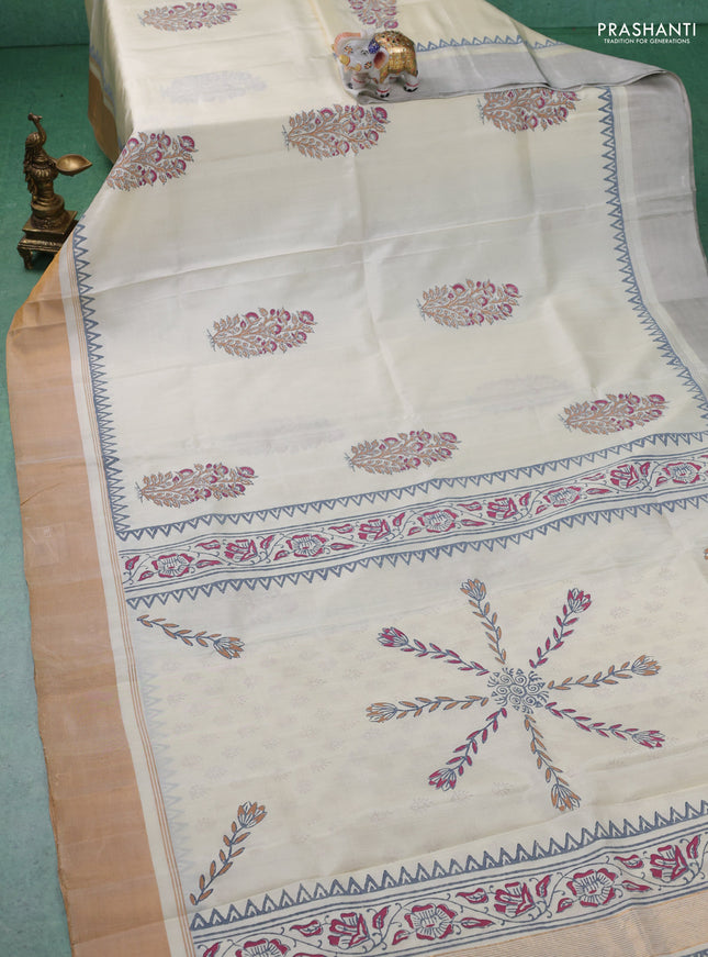 Uppada block printed silk saree cream with floral butta prints and ganga jamuna border