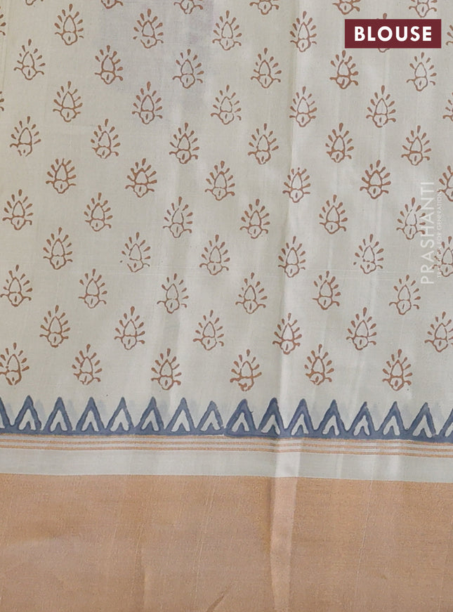 Uppada block printed silk saree cream with floral butta prints and ganga jamuna border