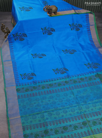 Uppada block printed silk saree cs blue and dual shade of blueish green with floral butta prints and zari woven border