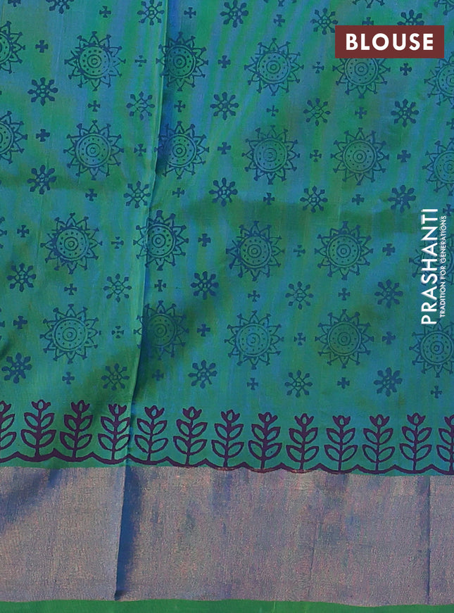 Uppada block printed silk saree cs blue and dual shade of blueish green with floral butta prints and zari woven border