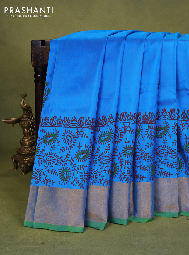 Uppada block printed silk saree cs blue and light green with paisly prints and zari woven border