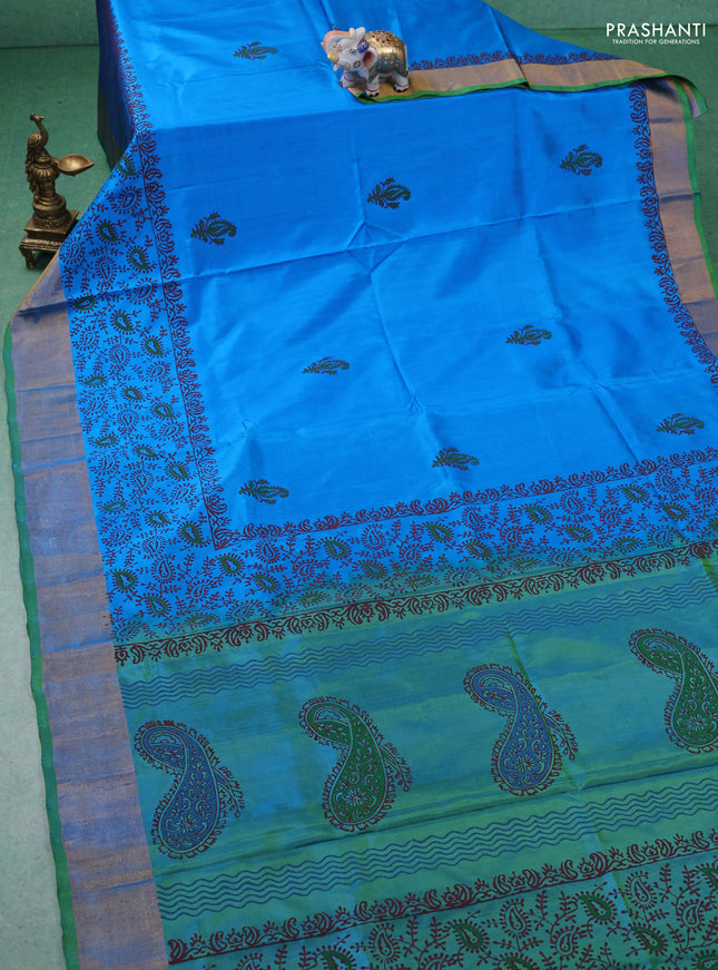 Uppada block printed silk saree cs blue and light green with paisly prints and zari woven border