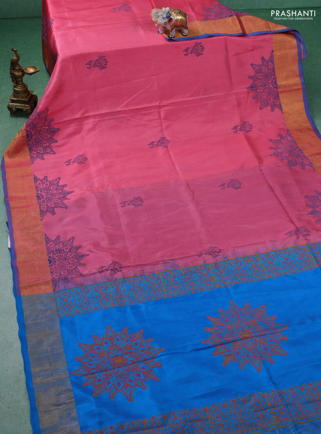 Uppada block printed silk saree peach pink and cs blue with floral prints and zari woven border