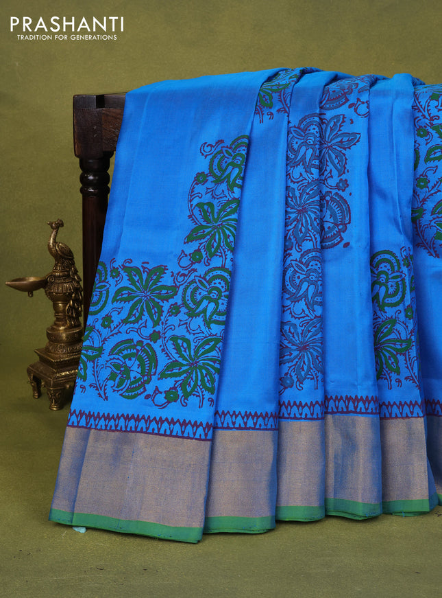 Uppada block printed silk saree cs blue and dual shade of green with allover floral butta prints and zari woven border