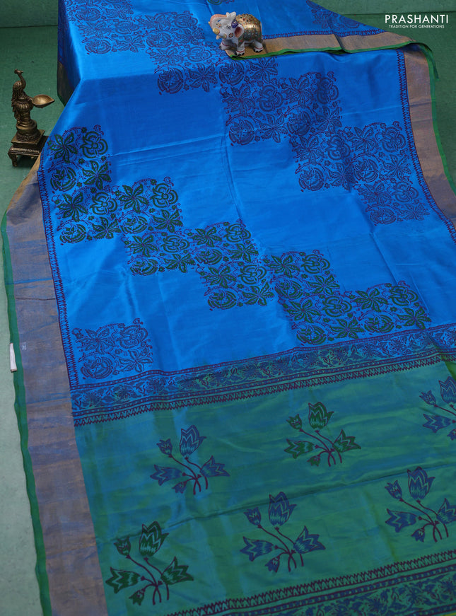 Uppada block printed silk saree cs blue and dual shade of green with allover floral butta prints and zari woven border