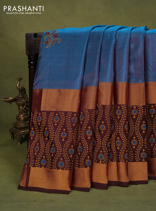 Uppada block printed silk saree peacock blue and brown with floral butta prints and long rettapet zari woven printed border
