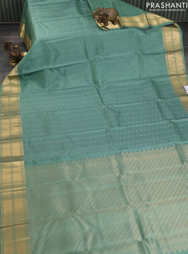 Pure soft silk saree pastel green with allover zari woven buttas and zari woven border