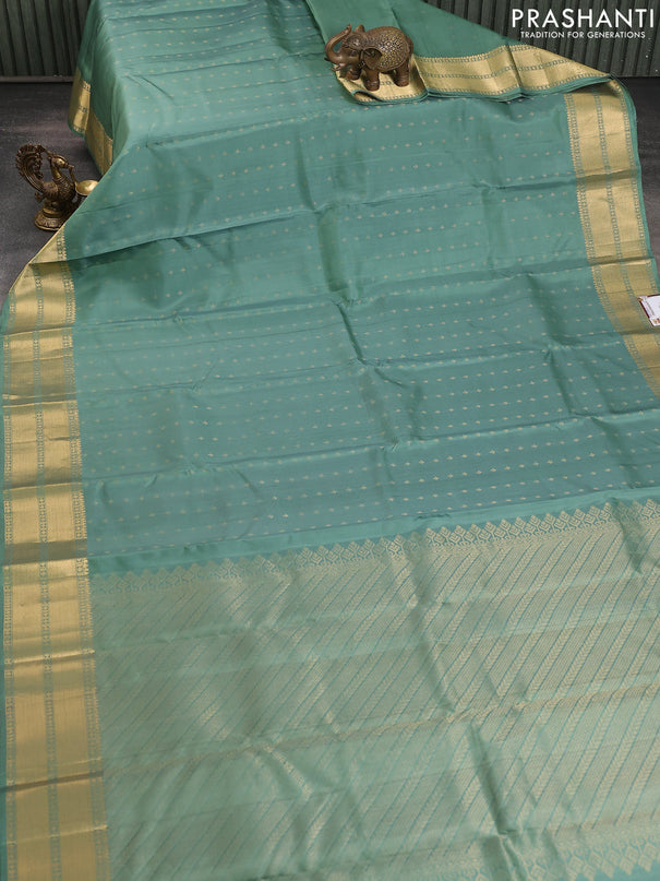 Pure soft silk saree pastel green with allover zari woven buttas and zari woven border