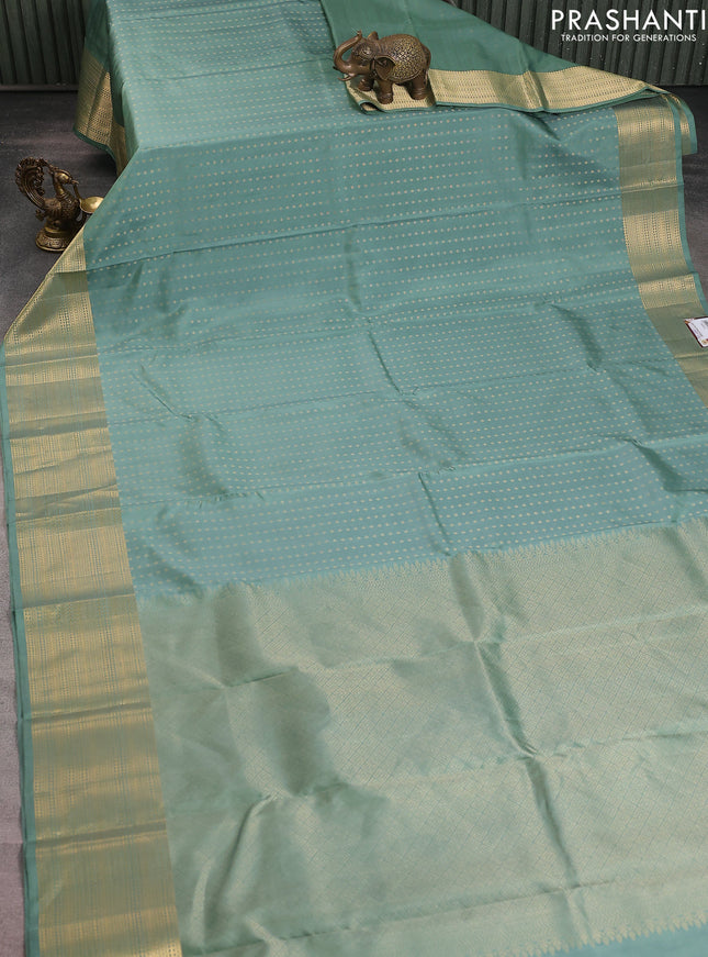 Pure soft silk saree pastel green with allover zari woven buttas and zari woven border