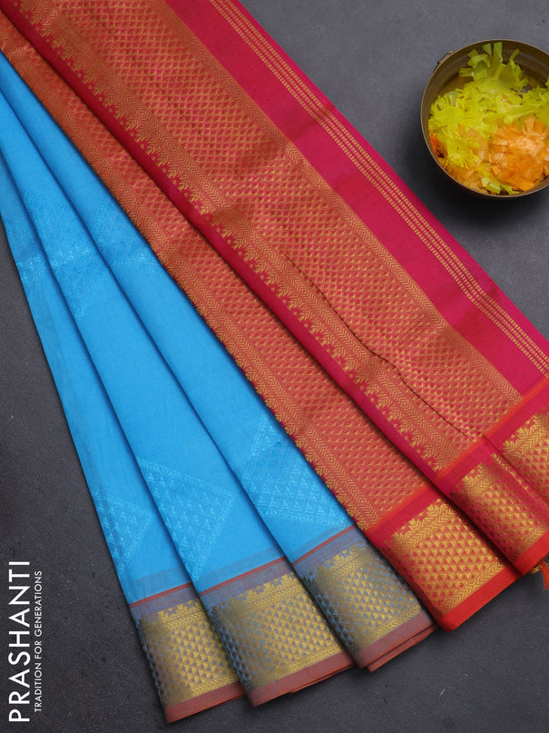 Silk cotton saree teal blue and dual shade of pinkish orange with allover self emboss jacquard and zari woven border