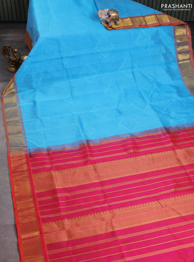Silk cotton saree teal blue and dual shade of pinkish orange with allover self emboss jacquard and zari woven border