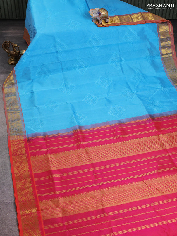 Silk cotton saree teal blue and dual shade of pinkish orange with allover self emboss jacquard and zari woven border