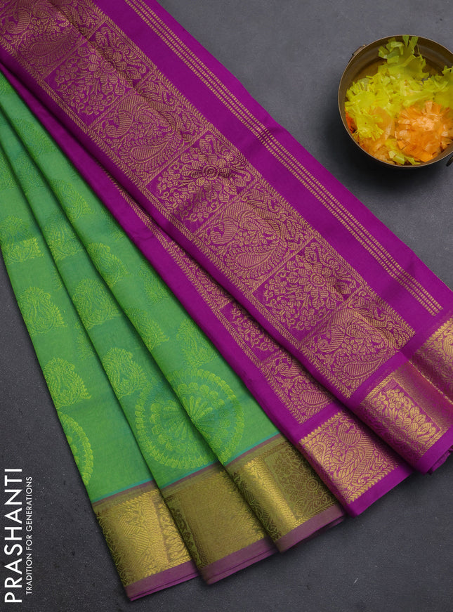 Silk cotton saree dual shade of green and magenta pink with allover self emboss jacquard and annam zari woven border
