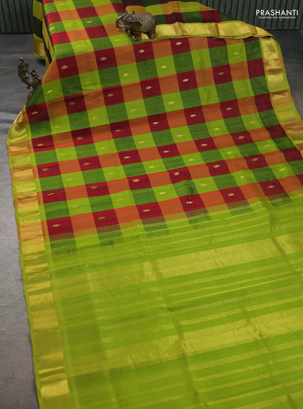 silk cotton saree multi colour and light green with allover paalum pazhamum checks pattern zari buttas and zari woven border