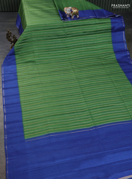 Semi tussar saree green and blue with allover silver & gold zari weaves and simple zari border