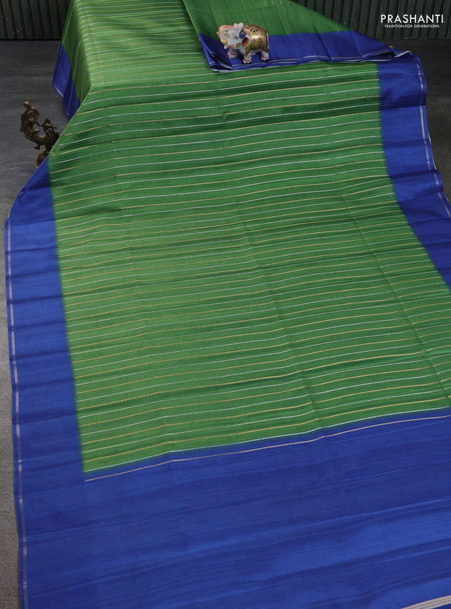Semi tussar saree green and blue with allover silver & gold zari weaves and simple zari border