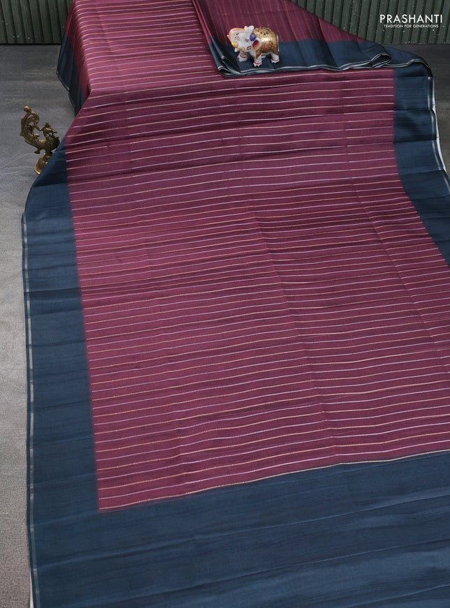 Semi tussar saree deep maroon and dark peacock green with allover silver & gold zari weaves and simple zari border