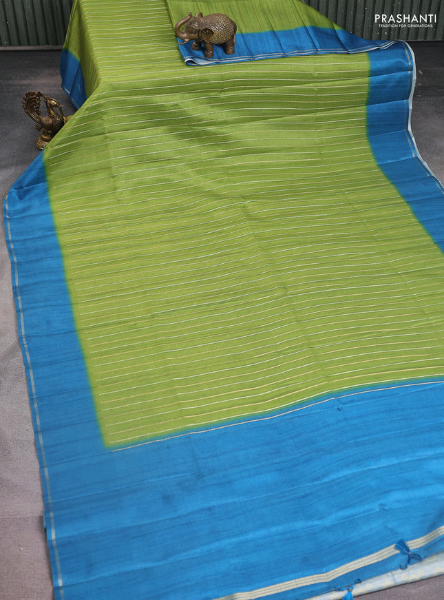 Semi tussar saree light green and peacock blue with allover silver & gold zari weaves and simple zari border
