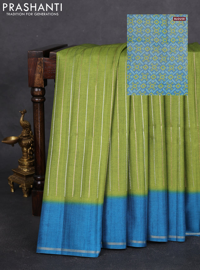 Semi tussar saree light green and peacock blue with allover silver & gold zari weaves and simple zari border