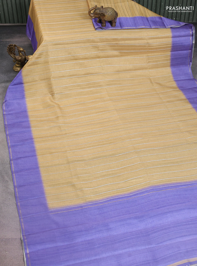 Semi tussar saree sandal and violet with allover silver & gold zari weaves and simple zari border