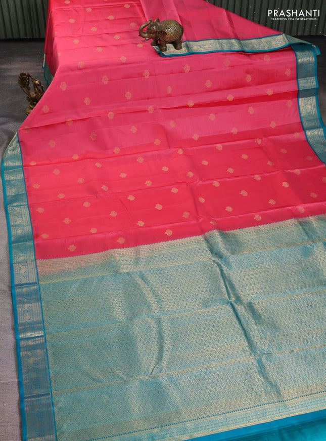 Pure kanchipuram silk saree pink and teal green with floral zari woven buttas and zari woven korvai border
