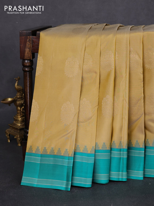 Pure kanchipuram silk saree sandal and teal green with zari woven buttas and temple design woven border
