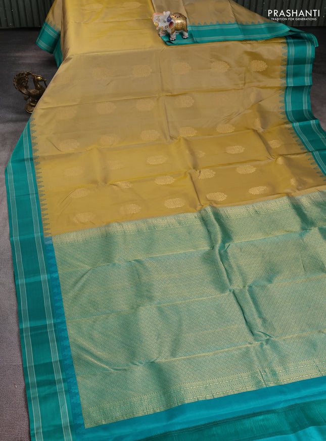 Pure kanchipuram silk saree sandal and teal green with zari woven buttas and temple design woven border