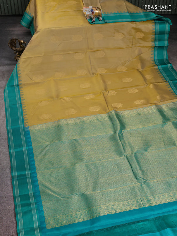 Pure kanchipuram silk saree sandal and teal green with zari woven buttas and temple design woven border