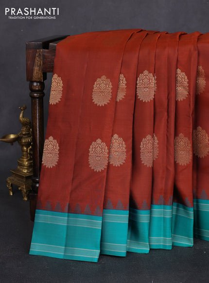 Pure kanchipuram silk saree rust shade and teal green with zari woven buttas and temple design woven border