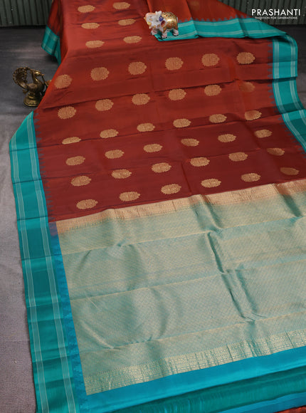 Pure kanchipuram silk saree rust shade and teal green with zari woven buttas and temple design woven border
